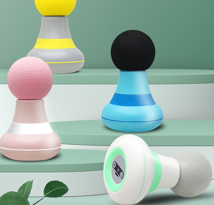 Mini pocket massage gun in hand