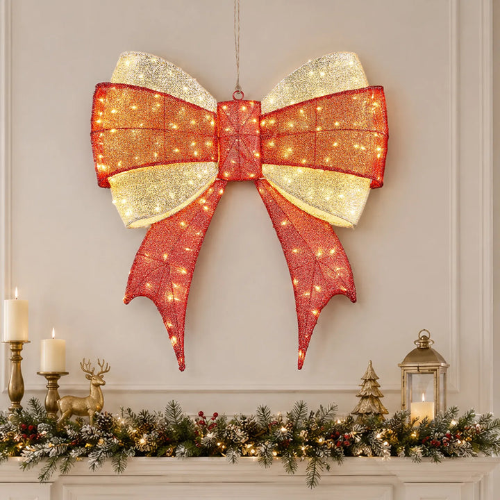 Large lighted red and gold Christmas bow