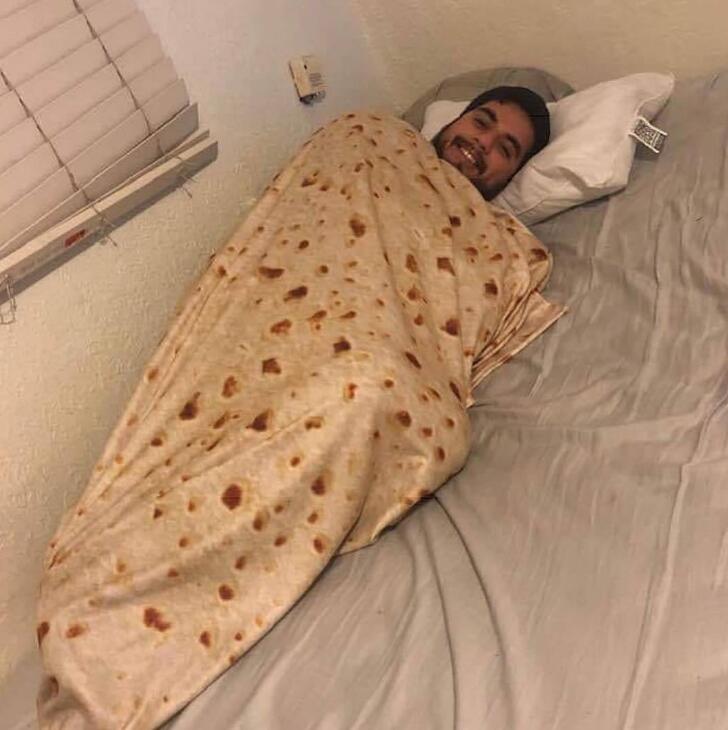 Person wrapped in a tortilla blanket