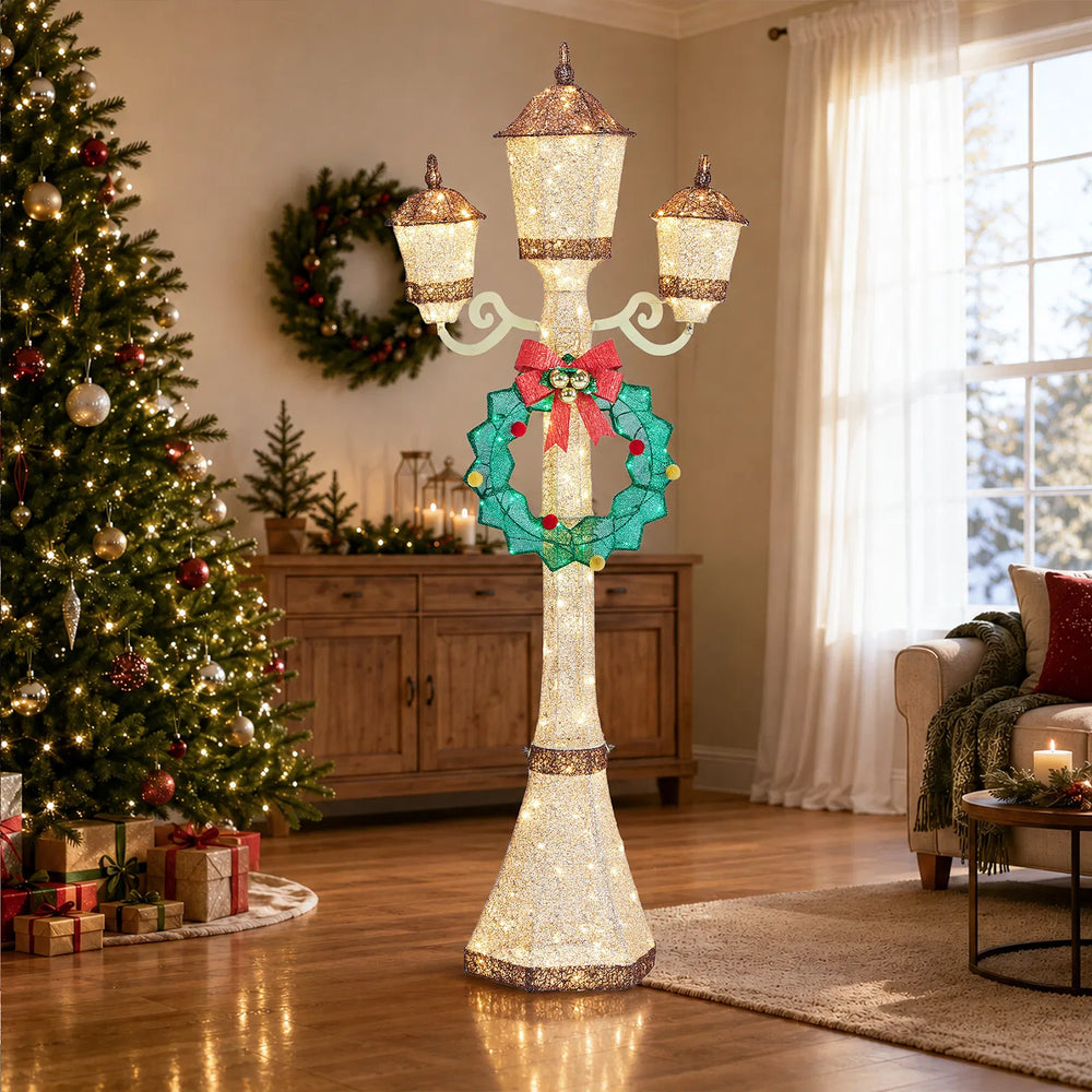 Gold Christmas lamp post with wreath glowing