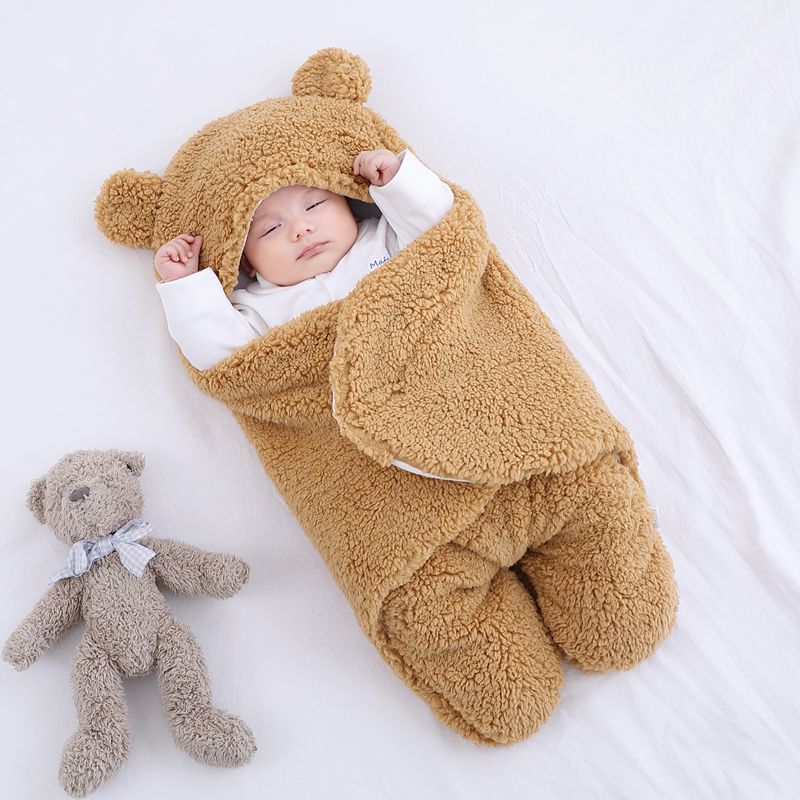 Baby in a bear ear sleep sack