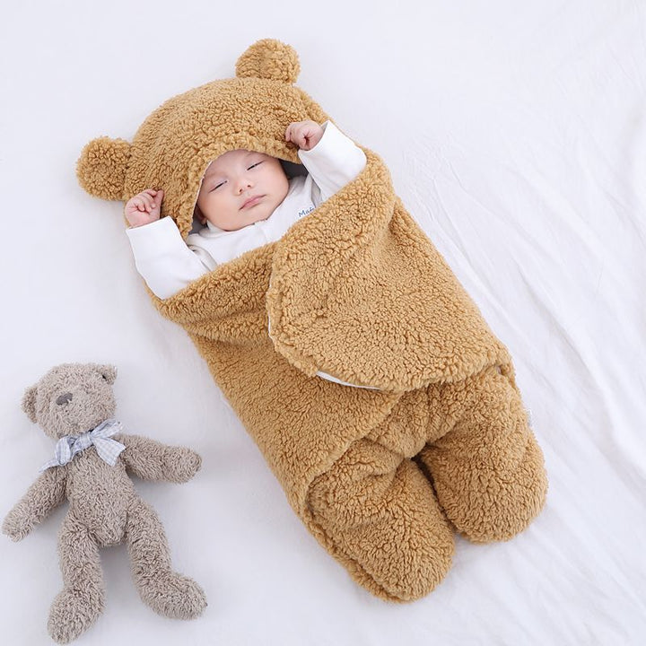 Baby in a bear ear sleep sack