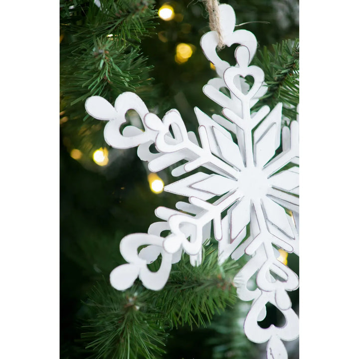 White iron snowflake ornaments with rope hangers