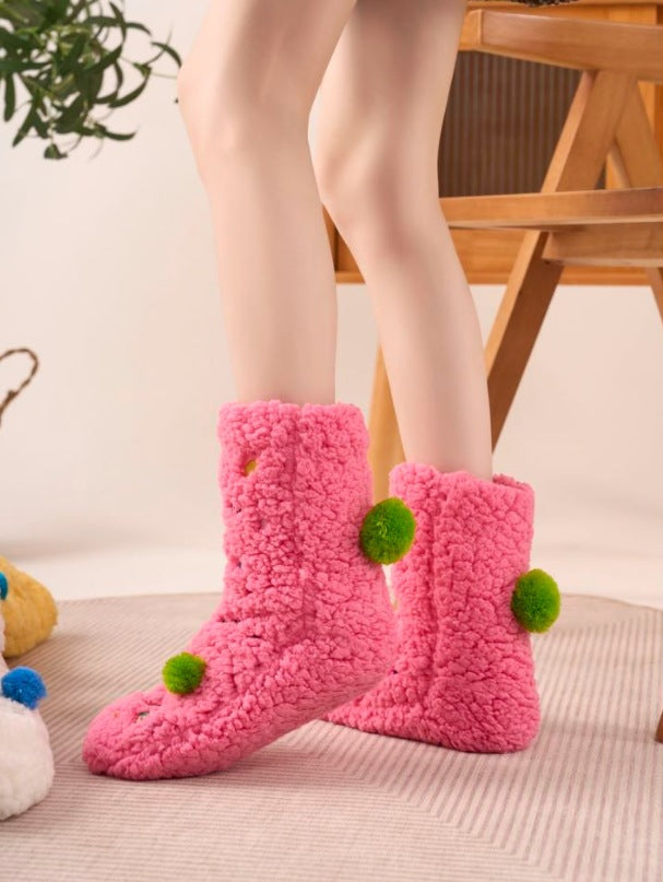 Fluffy pink floor socks with embroidered faces