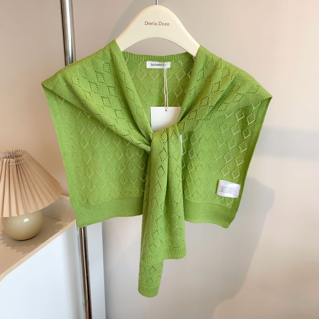 Woman wearing a knit shoulder wrap