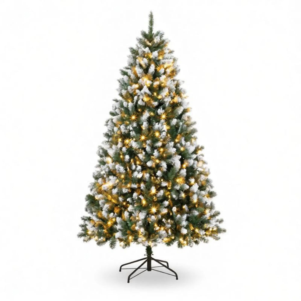 Tall snow tipped pre-lit Christmas tree
