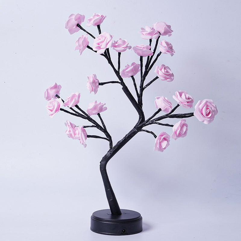 Glowing rose tree lamp on a table