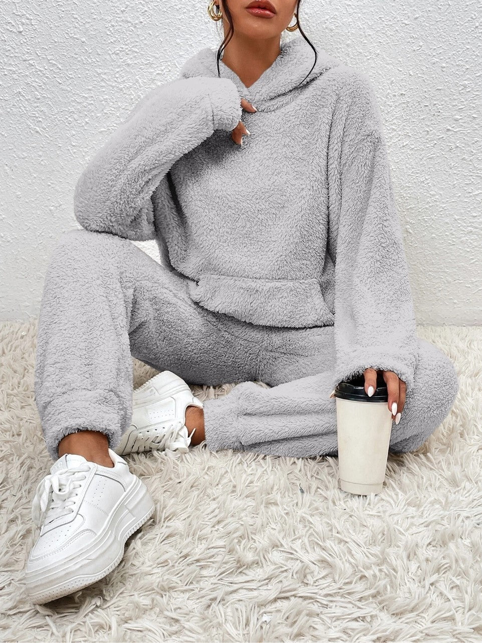 Woman in a fuzzy hoodie lounge set