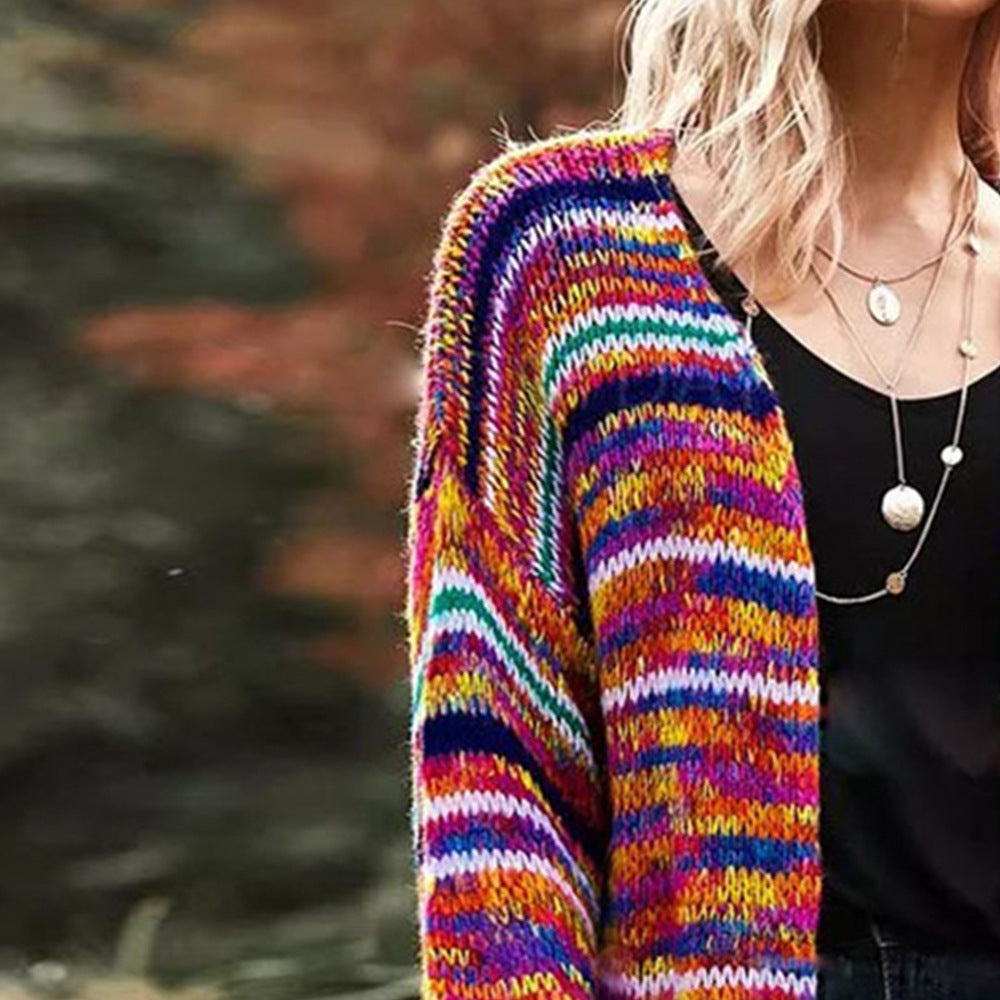 Woman in a rainbow striped chunky cardigan