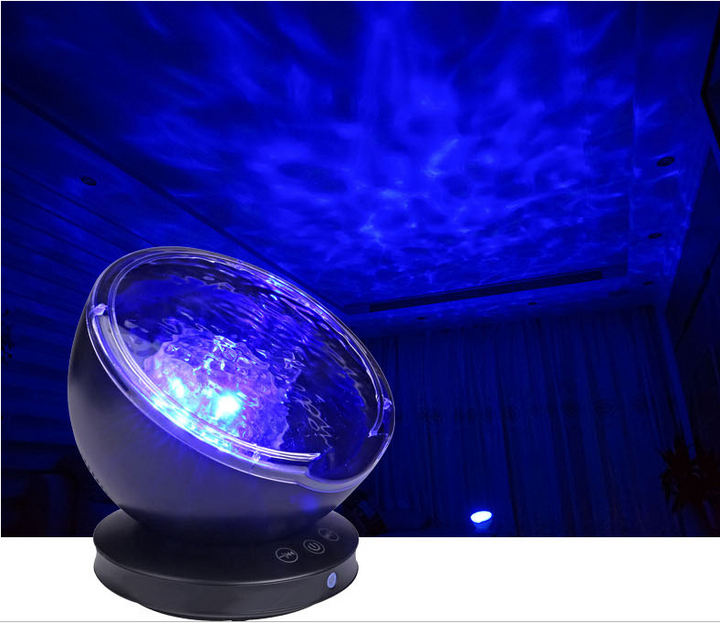 Ocean wave projector lighting a bedroom