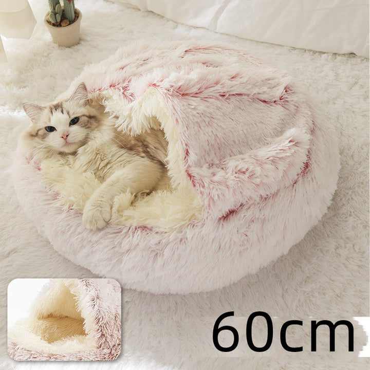 Cat curled up in a round plush bed with hood