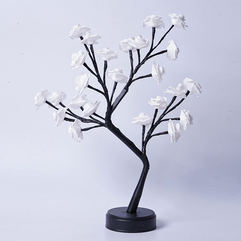 Glowing rose tree lamp on a table
