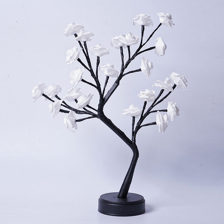 Glowing rose tree lamp on a table