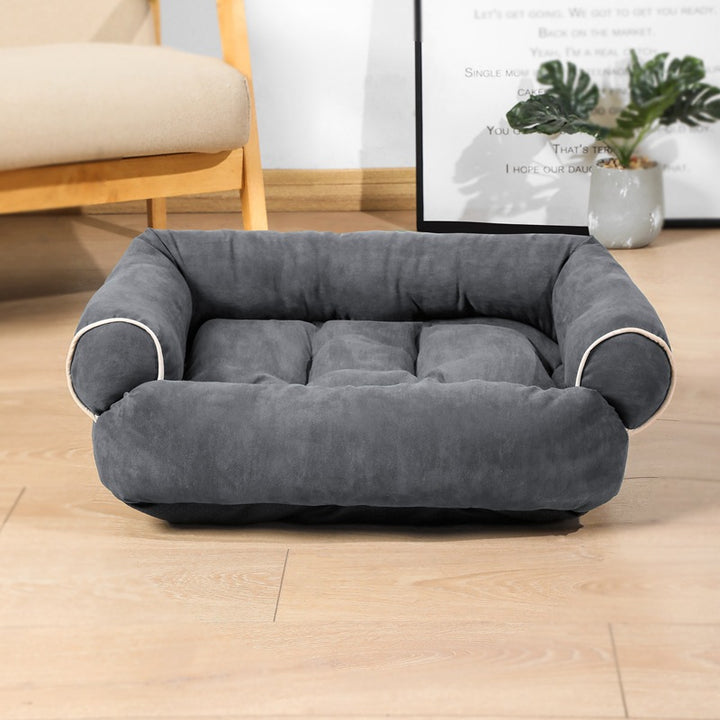 Plush sofa-style pet bed with bolsters