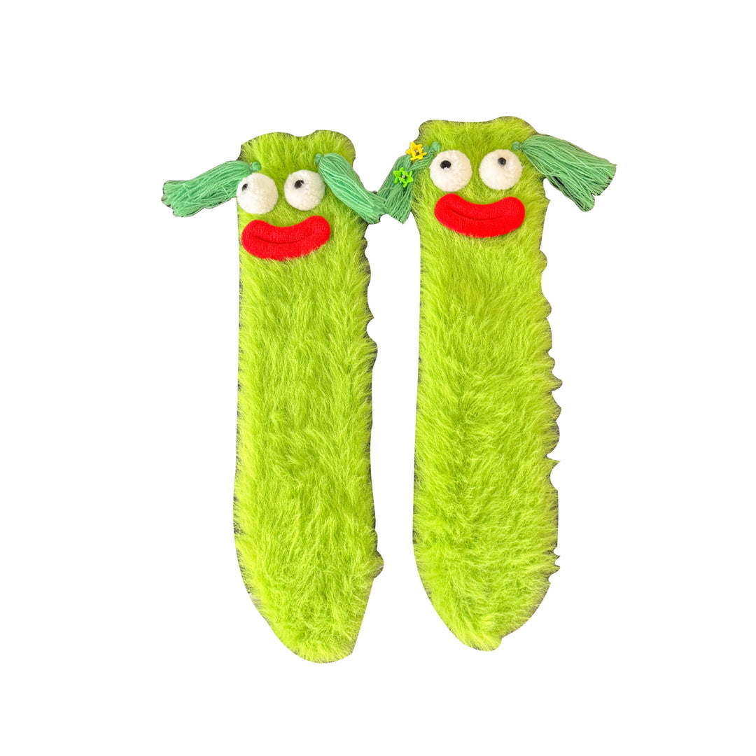 Fluffy green plush socks with googly-eyed monster faces
