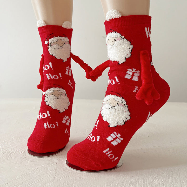 Couple wearing magnetic Christmas socks