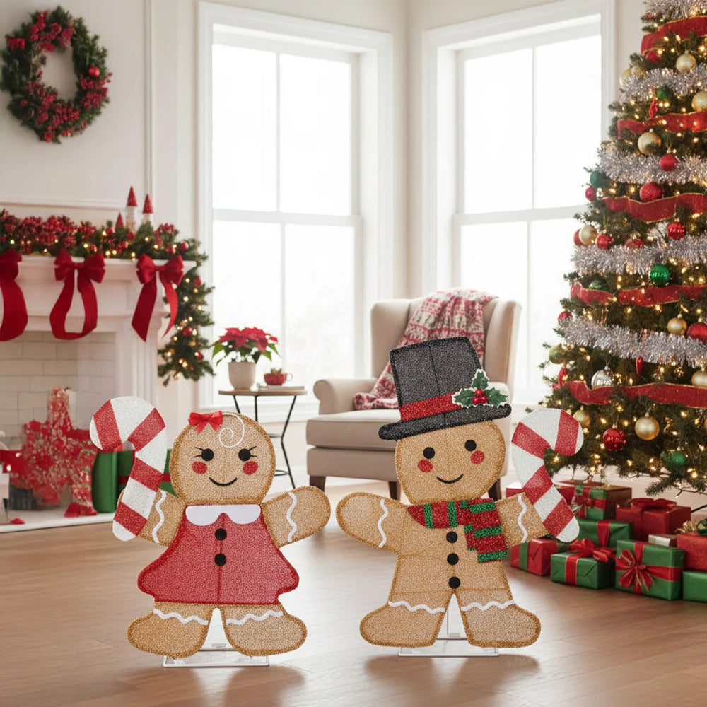 Two lighted gingerbread figures with candy canes