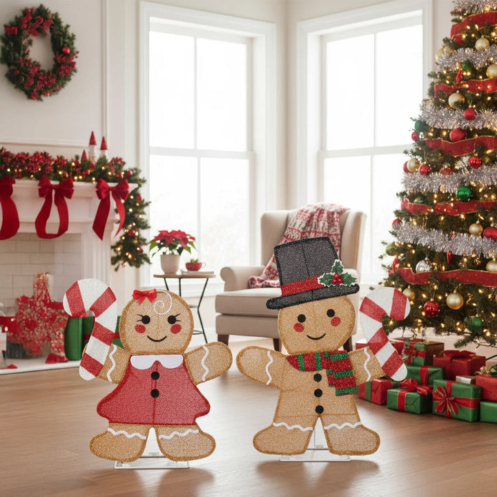 Two lighted gingerbread figures with candy canes