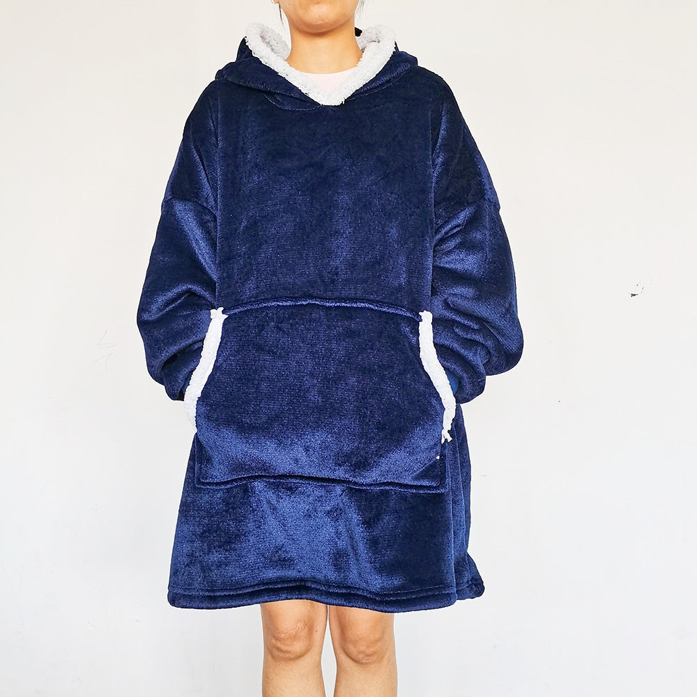 Person wearing an oversized blanket hoodie