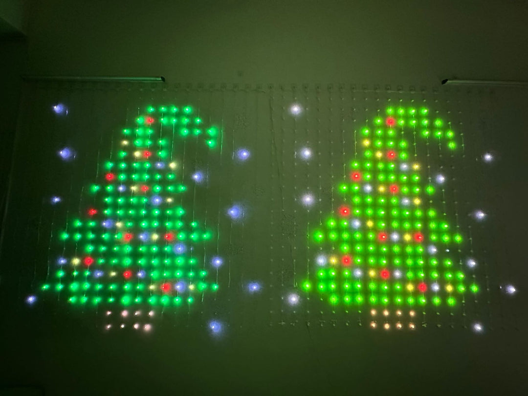 Smart LED curtain light showing a Christmas pattern