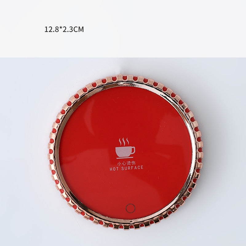 Mug on a round heated coaster with metallic rim