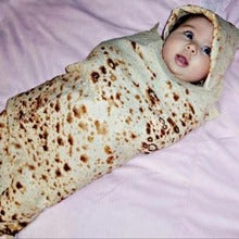 Person wrapped in a tortilla blanket
