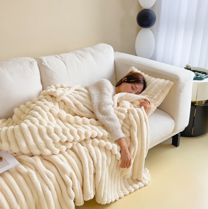 Ribbed faux fur blanket on a sofa
