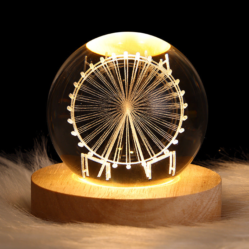 Glowing crystal ball with Saturn engraving