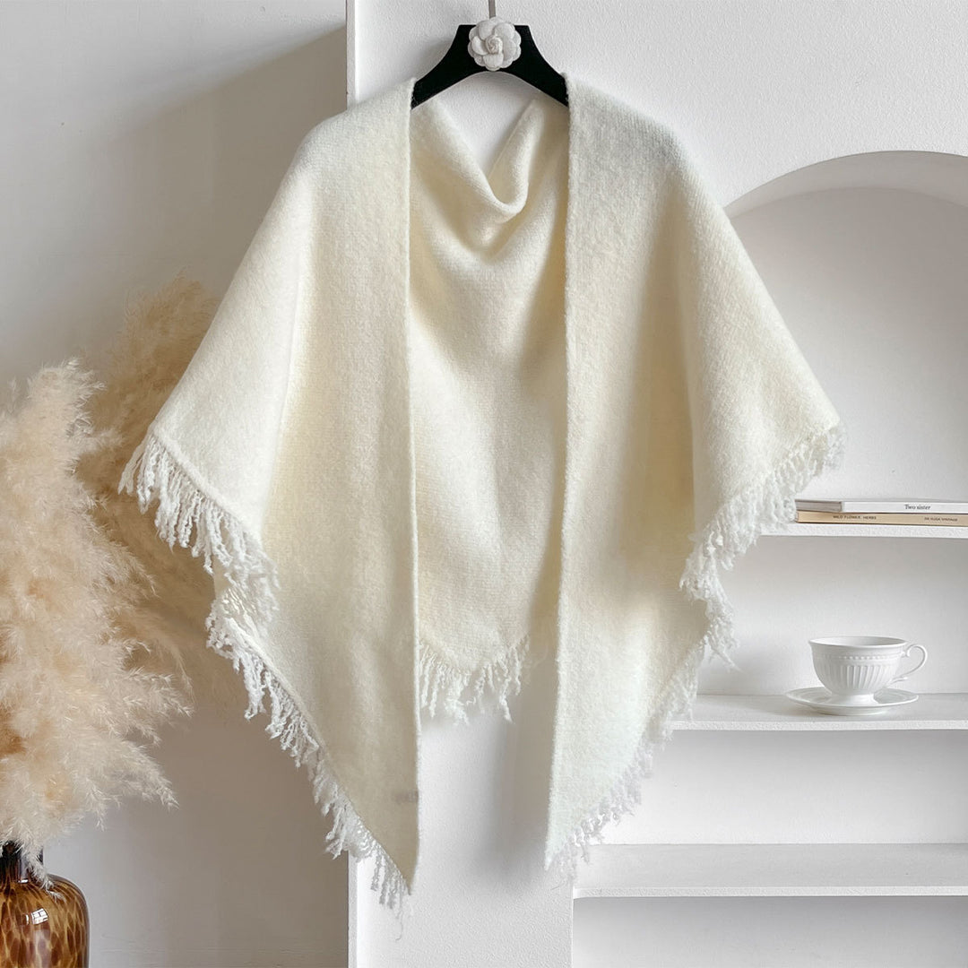 Woman wearing an ivory fringe scarf