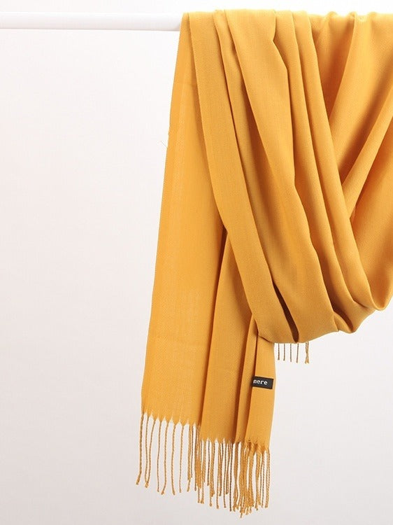 Woman wearing a soft wine red scarf