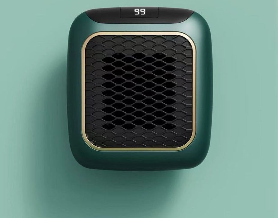 Mini plug in heater on a wall outlet