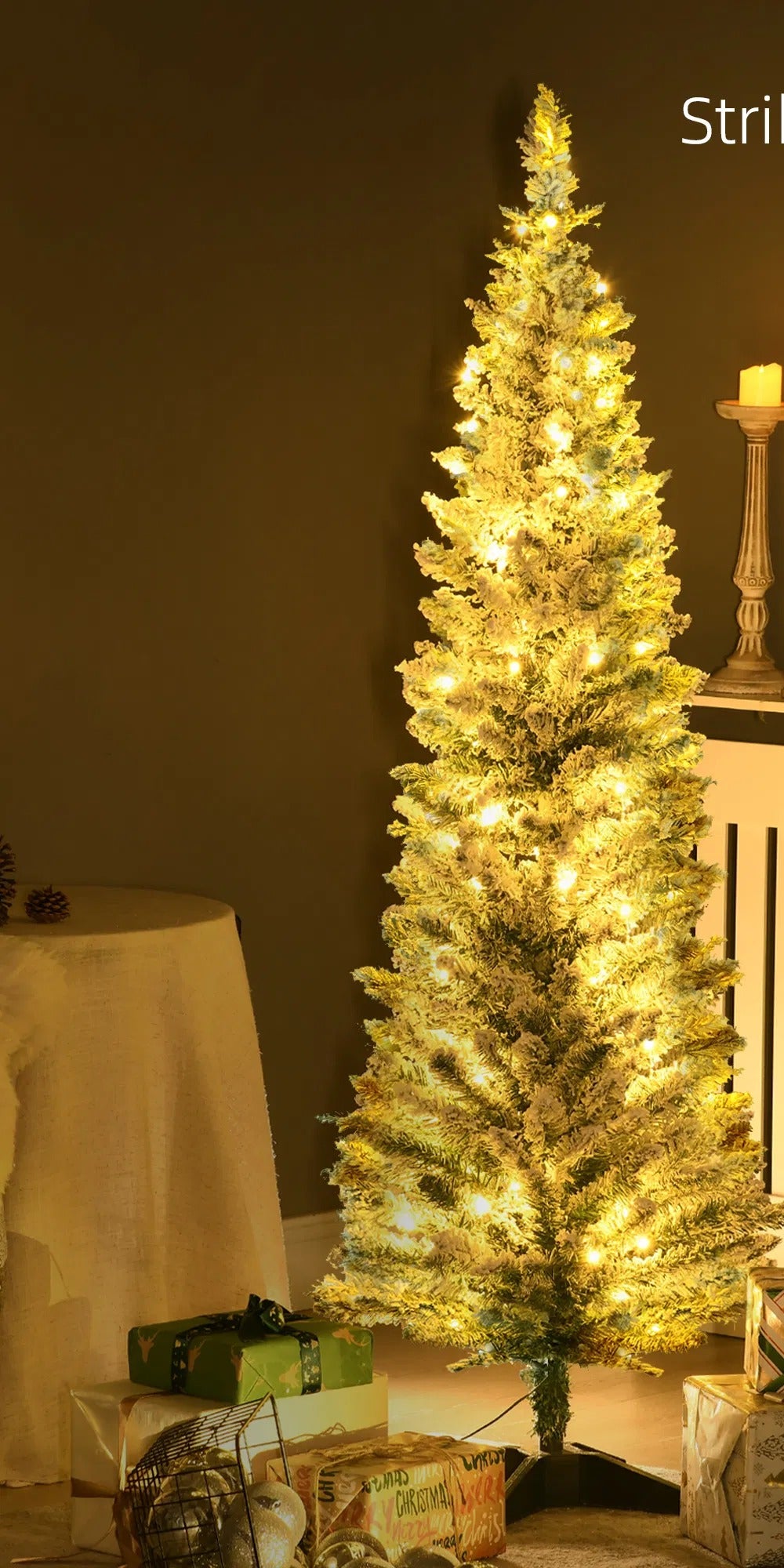 Pre-lit snow flocked pencil tree glowing warm