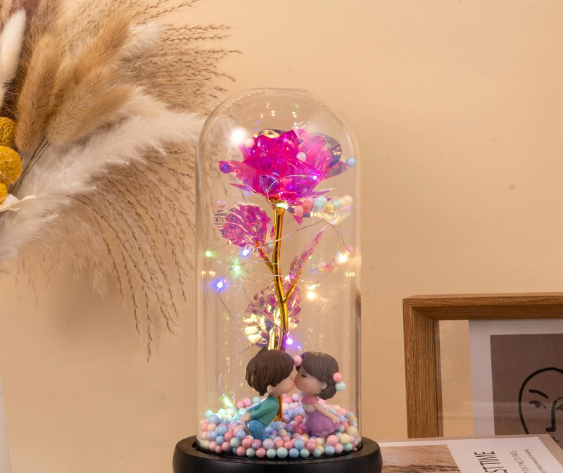 Red eternal rose glowing in glass dome