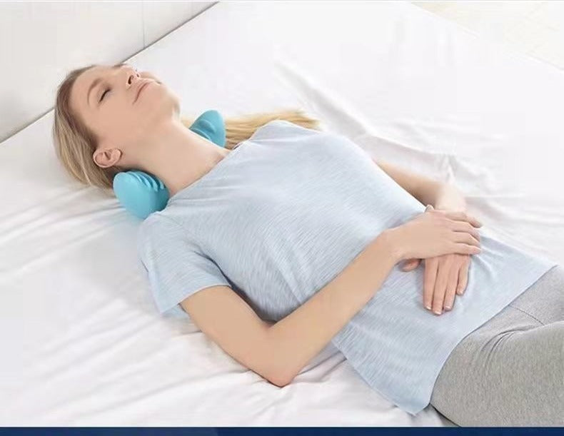 Contoured foam neck pillow with massage nodes