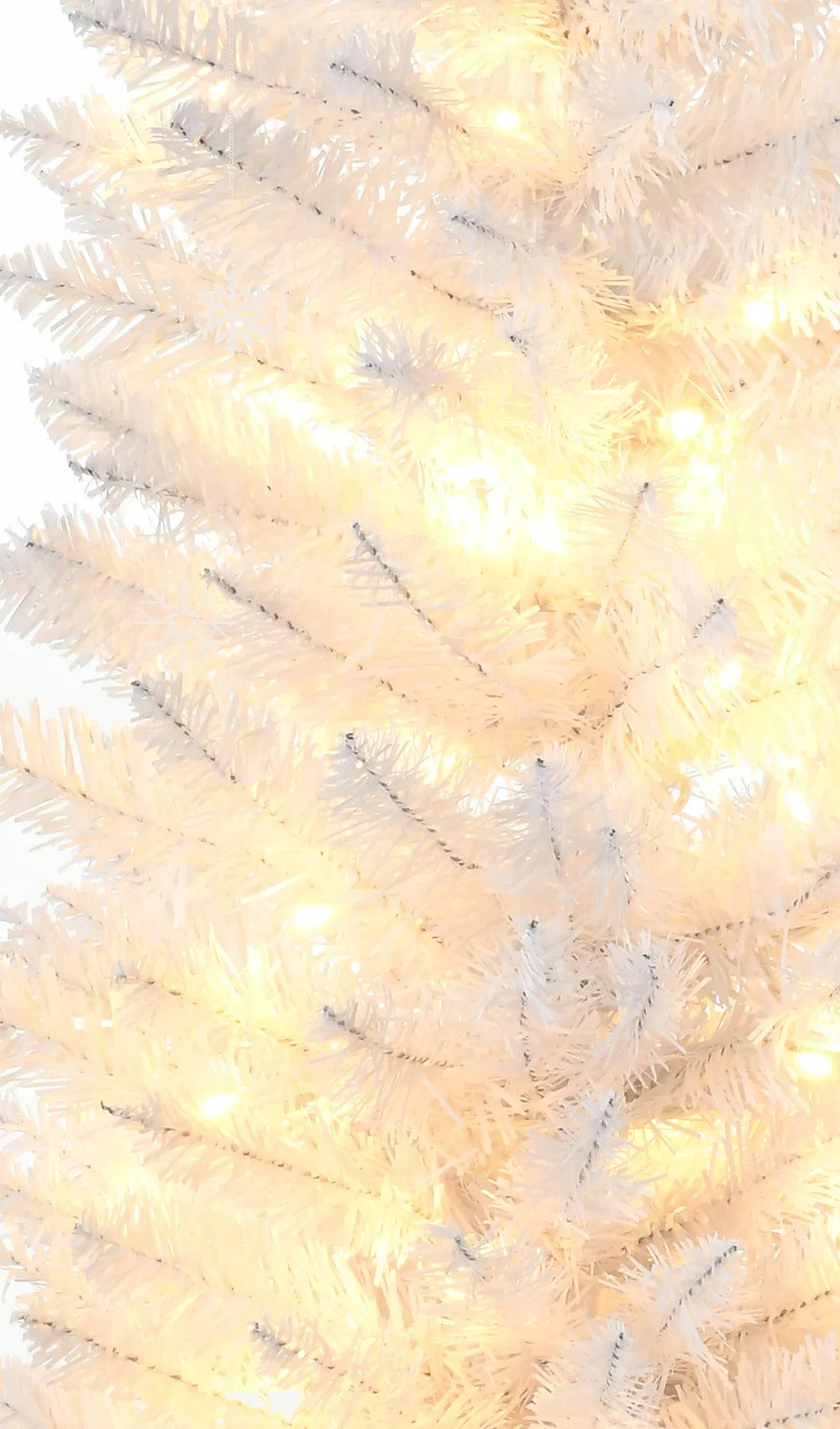White pre-lit pencil Christmas tree with warm lights