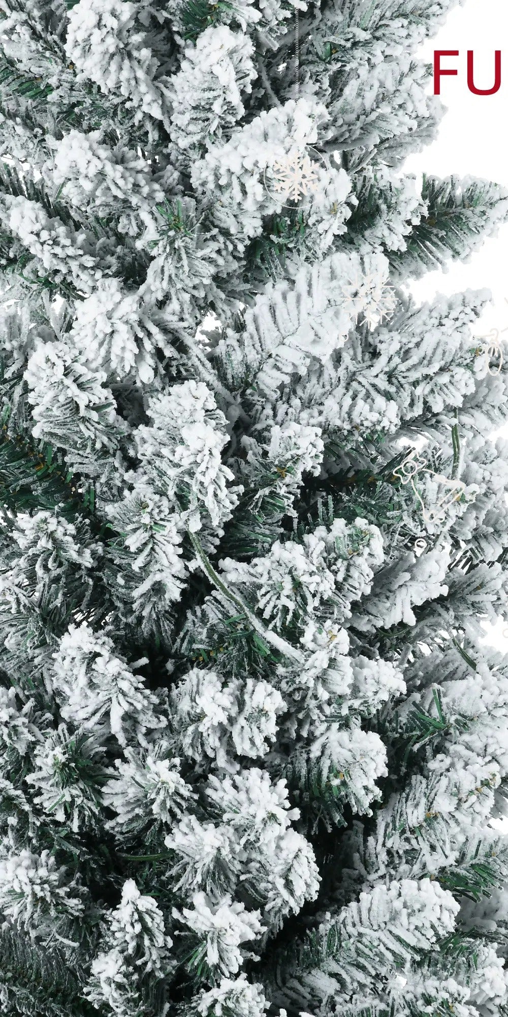 Pre-lit snow flocked pencil tree glowing warm