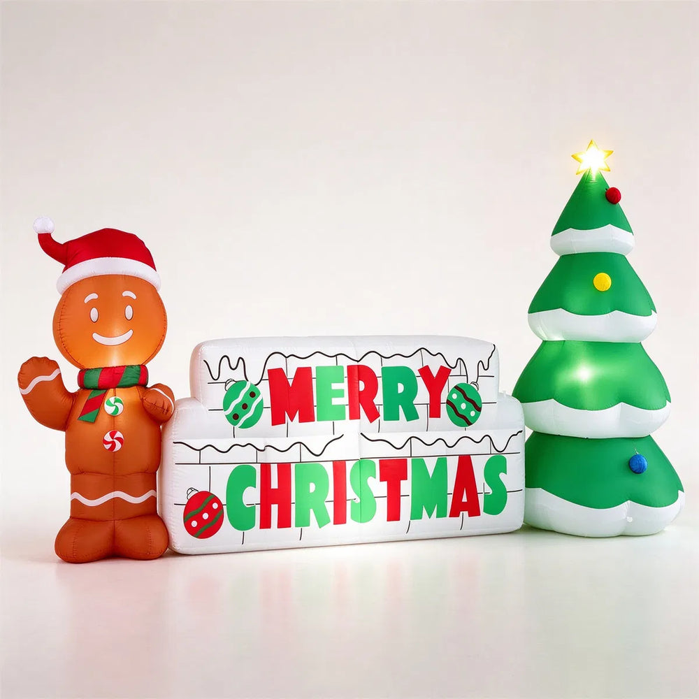 Inflatable Merry Christmas sign with gingerbread man on a lawn