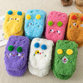 Fluffy pink floor socks with embroidered faces