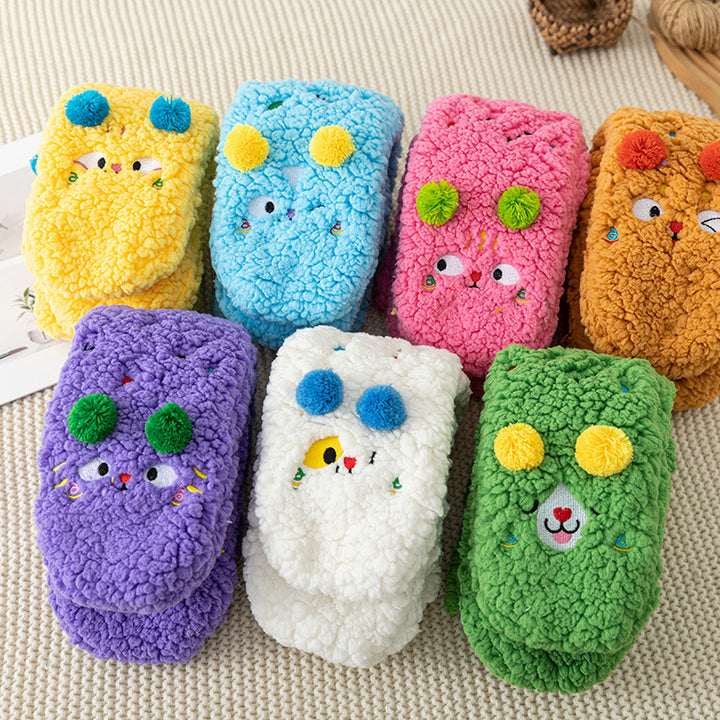 Fluffy pink floor socks with embroidered faces