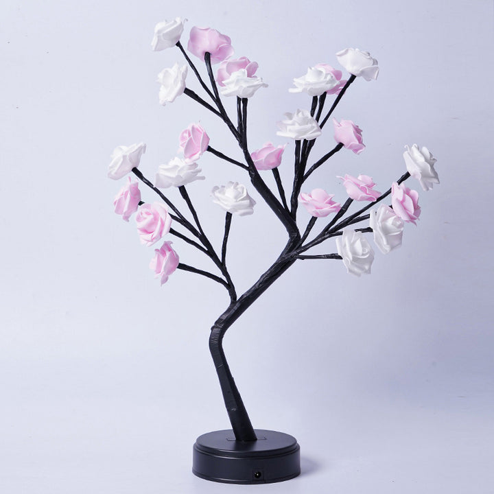 Glowing rose tree lamp on a table