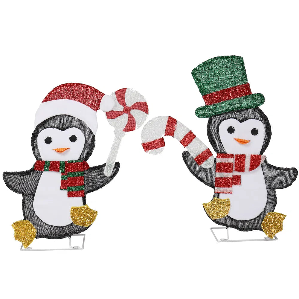 Two lighted penguins with candy canes