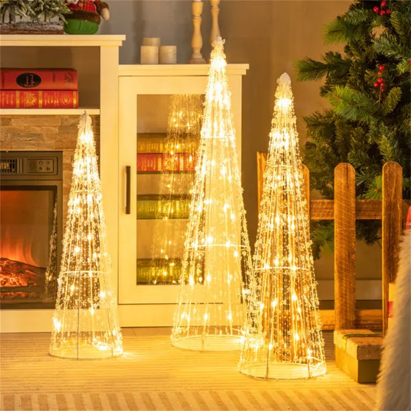 Three lighted cone Christmas trees outdoors
