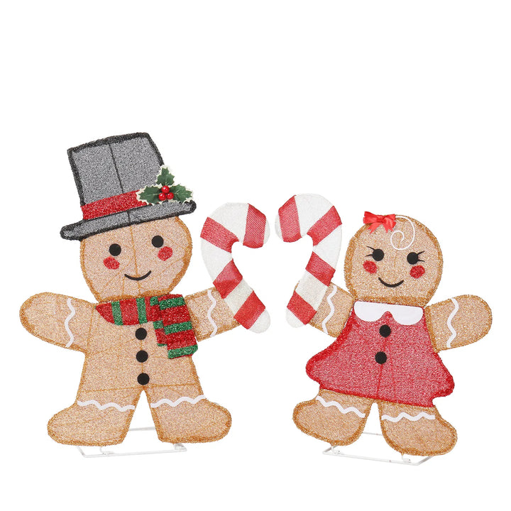 Two lighted gingerbread figures with candy canes