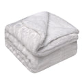 Thick sherpa fleece throw on a sofa