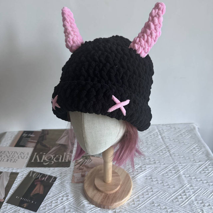 Black chunky crochet bucket hat with pink horns
