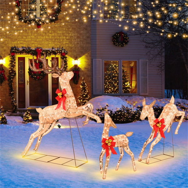 Three lighted glitter reindeer with red bows