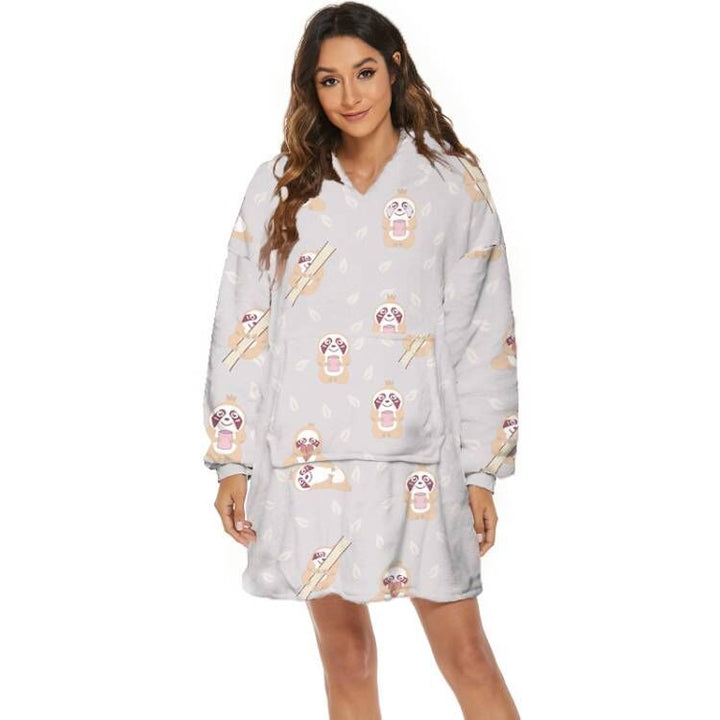 Person wearing oversized hooded blanket
