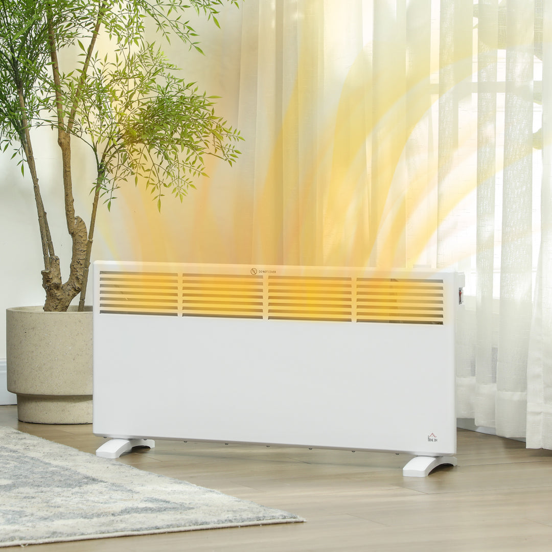 White freestanding convection heater on a wood floor