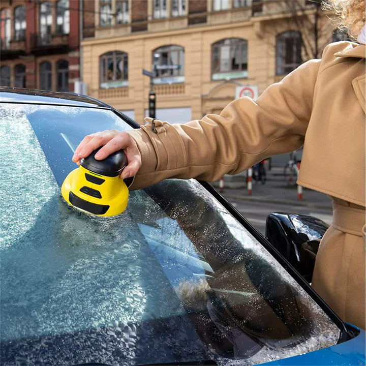 Cordless electric ice scraper on windshield
