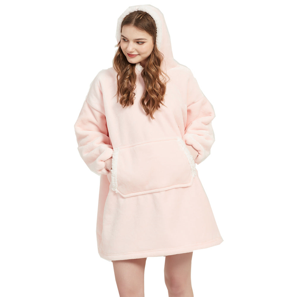 Person wearing an oversized blanket hoodie